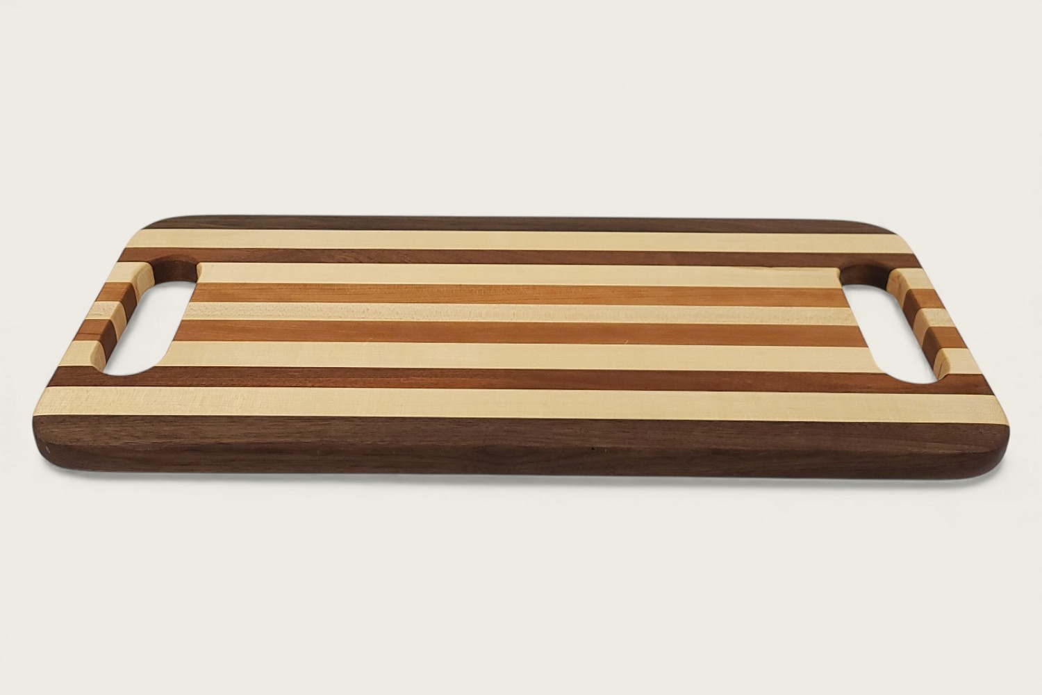 Original Maple Striped Charcuterie Board with edge-grain maple, walnut, mahogany, and cherry in a rectangular shape.